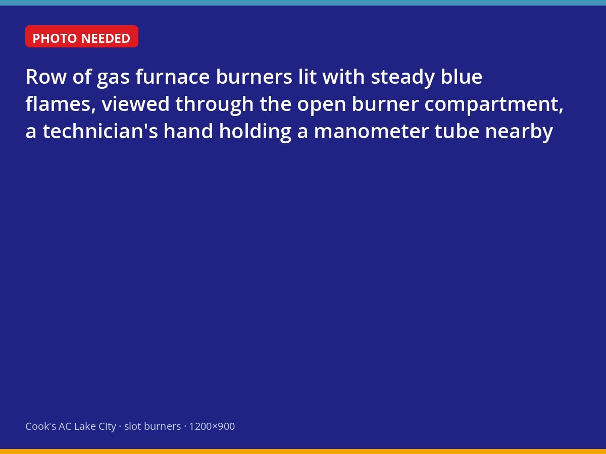 Clean blue burner flames inside a gas furnace during a maintenance inspection